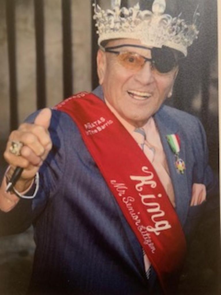 Santos “Mr. U” Uriegas wearing the Senior King crown and sash at Piñatas in the Barrio